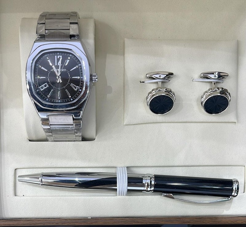 A gift set for men consisting of a wristwatch, a pair of cufflinks, and a ballpoint pen.